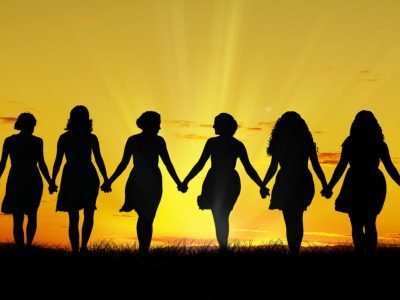 Silhouette of six young women, walking hand in hand